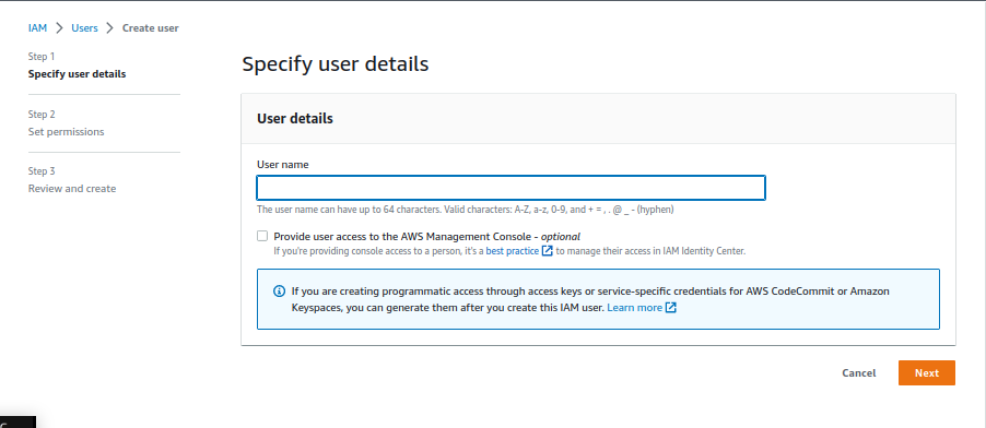 Captura de tela mostrando a primeira tela de criação de usuário no AWS IAM. Em inglês, o nome do assistente chama-se "Create user". A primeira tela chama-se "Specify user details" ou, em português, Especifique os detalhes do usuário".  A tela mostra o campo de Nome de usuário e uma caixa de seleção para o caso de se querer que o usuário sendo criado tenha acesso ao console de gerenciamento da AWS, que está desmarcado na iamgem.